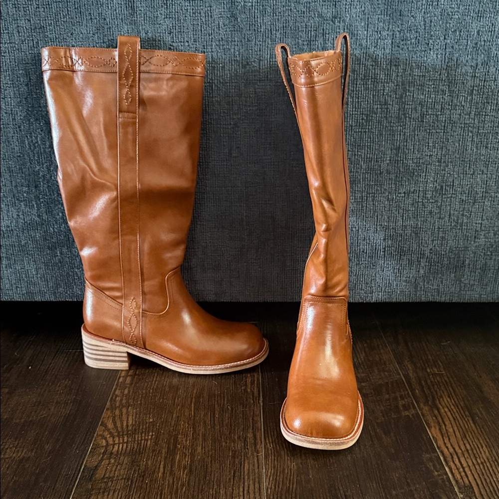 Cowboy boots. Mid calf or higher. Brand new